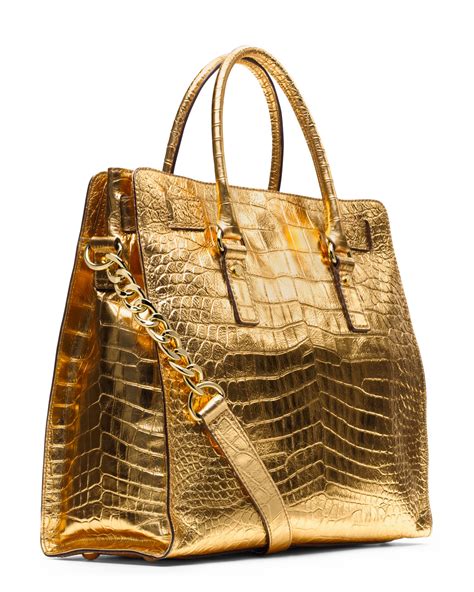 michael kors purse gold|michael kors large gold tote.